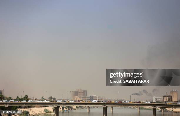 Picture shows vehicles on a bridge over the Tigris River near the Green Zone in the Iraqi capital Baghdad, on August 31 as calm returns after around...