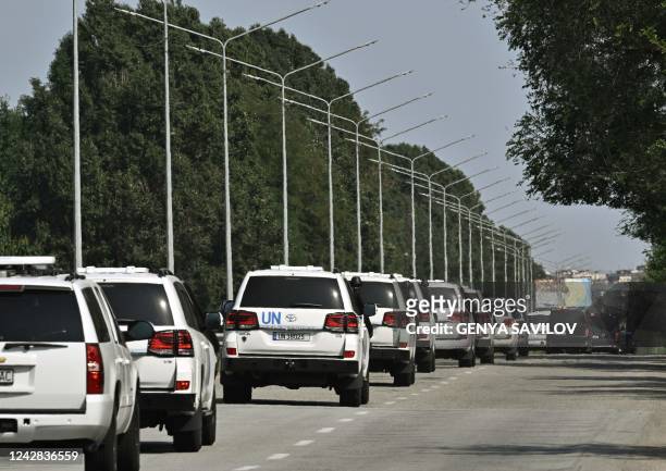 Vehicles transporting an International Atomic Energy Agency inspection team arrive to Zaporizhzhia on August 31, 2022. UN inspectors en route to a...