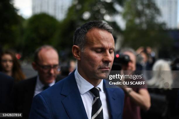 Former Manchester United star and Wales manager Ryan Giggs reacts as he leaves the Manchester Minshull Street Crown Court, in Manchester, on August...