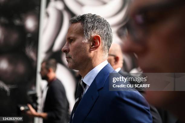 Former Manchester United star and Wales manager Ryan Giggs reacts as he leaves the Manchester Minshull Street Crown Court, in Manchester, on August...