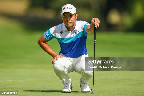 Taiga Semikawa of Japan lines before plays his third shot on the 12th hole during Day One of the 2022 World Amateur Team Golf Championships -...