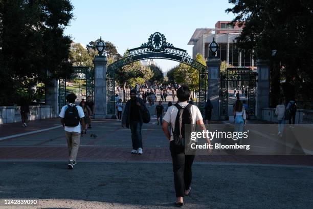 Students pass through Sather Gate on the University of California, Berkeley campus in Berkeley, California, US, on Tuesday, Aug. 30, 2022. College...