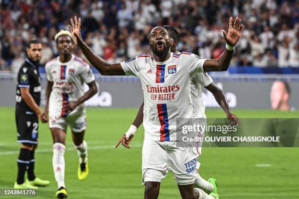 Lyon's Cameroonian forward Karl Toko Ekambi celebrates after scoring his team's second goal during the French L1 football match between Olympique...