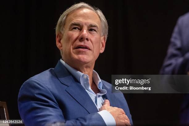 Greg Abbott, governor of Texas, participates in the Pledge of Allegiance during a campaign event at the Heritage Ranch Golf Club House in Fairview,...