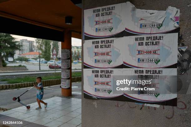 Posters against reciprocal measures on car registration plates are seen on August 31, 2022 in Mitrovica, Kosovo. Kosovo and Serbia verbally agreed on...