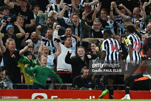 Newcastle United's Swedish striker Alexander Isak celebrates with fans after scoring the opening goal of the English Premier League football match...