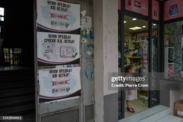 Posters against reciprocal measures on car registration plates and identity documents are seen on August 31, 2022 in Mitrovica, Kosovo. Kosovo and...