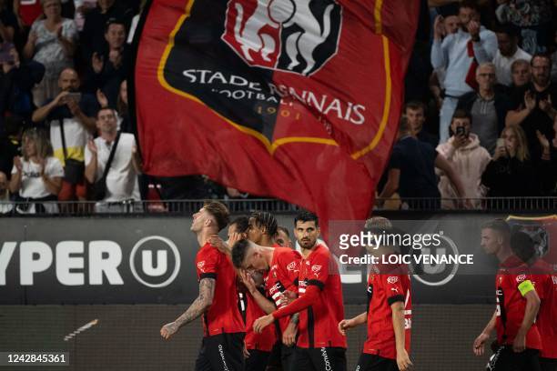 Rennes' Welsh defender Joseph Rodon celebrates with teammates after scoring his team's first goal during the French L1 football match between Stade...