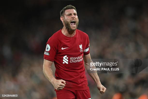 Liverpool's English midfielder James Milner celebrates on the pitch after the English Premier League football match between Liverpool and Newcastle...