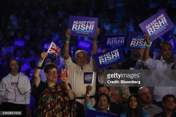 Rishi Sunak supporters hold placards during a Conservative Party leadership hustings in London, UK, on Wednesday, Aug. 31, 2022. Pressure is mounting...