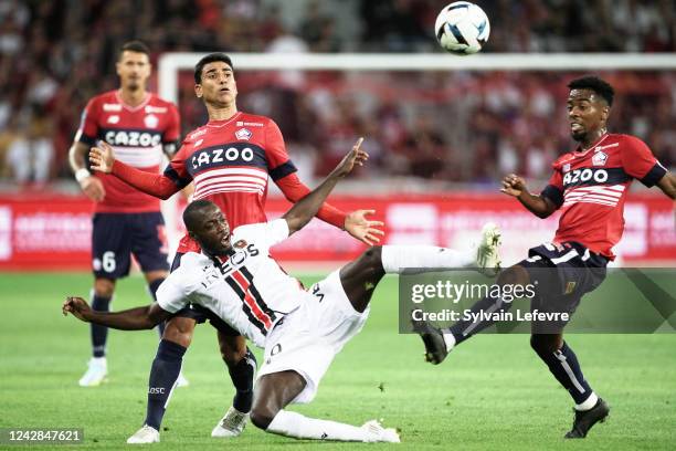 Nicolas Pepe of OGC Nice is challenged by Benjamiin Andre of Lille OSC and Adilson Angel abreu de Almeida Gomes of Lille OSC during the Ligue 1 match...