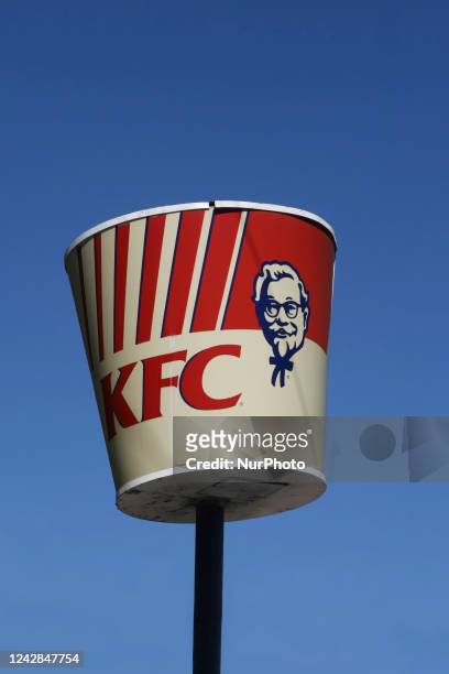 'Bucket of chicken' sign on a pole outside a Kentucky Fried Chicken restaurant in Ontario, Canada.