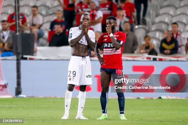 Nicolas Pepe of OGC Nice talks to his former teammate Jonathan Bamba of Lille OSC after the Ligue 1 match between Lille and Nice on August 31, 2022...