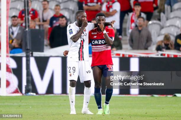 Nicolas Pepe of OGC Nice talks to his former teammate Jonathan Bamba of Lille OSC after the Ligue 1 match between Lille and Nice on August 31, 2022...