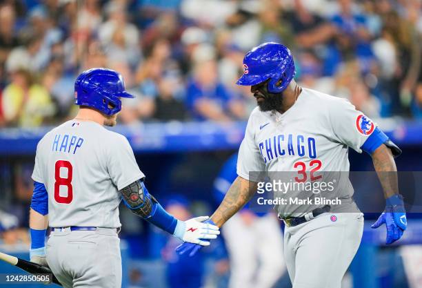 Franmil Reyes of the Chicago Cubs celebrates his solo home run with Ian Happ against the Toronto Blue Jays in the fifth inning at the Rogers Centre...