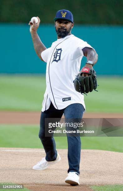 Former NFL and Heisman Trophy winning University of Michigan football player Charles Woodson throws out a ceremonial first pitcher before the Detroit...
