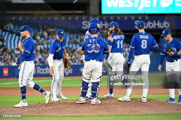 Yimi Garcia of the Toronto Blue Jays replaces David Phelps in the seventh inning during the game between the Chicago Cubs and the Toronto Blue Jays...