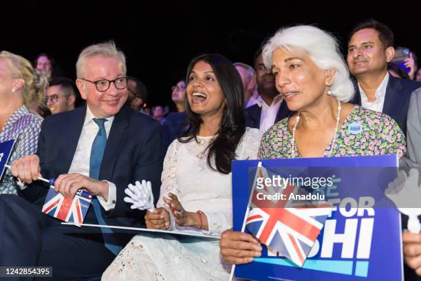 Michael Gove , Rishi Sunak's wife Akshata Murty and mother Usha Sunak sit in the audience during the final Conservative leadership election hustings...