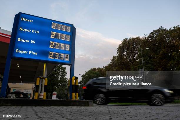 September 2022, Bavaria, Munich: A car drives past the price board at a gas station in Munich. In the night from August 31 to September 1, a...