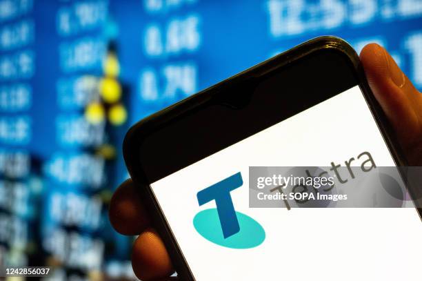 In this photo illustration, Australia's largest telecommunications company Telstra logo is displayed on a smartphone screen.