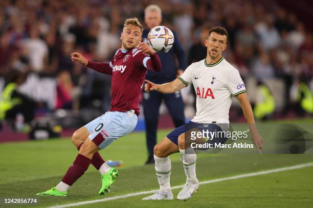 Jarrod Bowen of West Ham in action with Ivan Perisic of Tottenham Hotspur during the Premier League match between West Ham United and Tottenham...