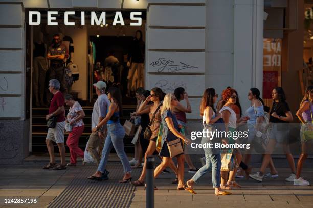 Shoppers pass by a Decimas clothing store in Madrid, Spain, on Wednesday, Aug. 31, 2022. Spanish inflation eased for the first time in four months,...