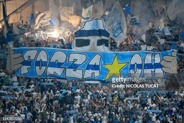 Marseille's fans cheer during the French L1 football match between Olympique Marseille and Clermont Foot 63 at Stade Velodrome in Marseille, southern...