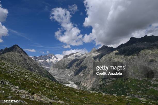 Effects of the climate crisis can be observed in receding and disappearing glaciers of the Swiss Alps near Gletsch from which the word glacier is...