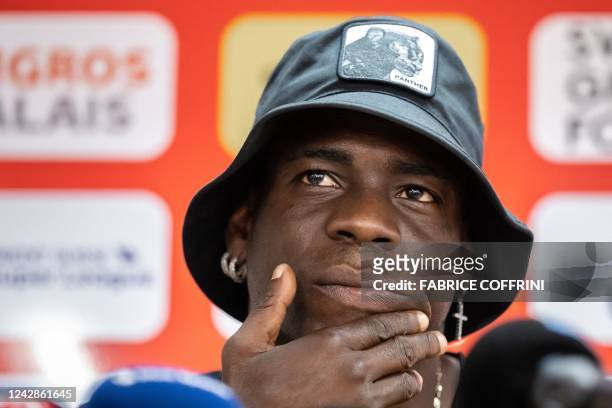 Italy's football striker Mario Balotelli gestures at a press conference on September 1 after he signed a two-year contract with Swiss side FC Sion,...