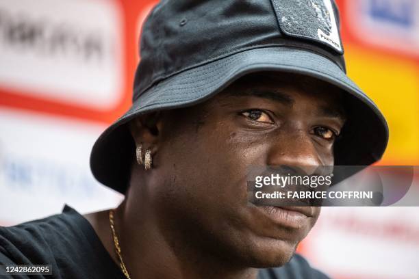 Italy's football striker Mario Balotelli looks on during a press conference on September 1 after he signed a two-year contract with Swiss side FC...