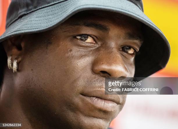Italy's football striker Mario Balotelli looks on during a press conference on September 1 after he signed a two-year contract with Swiss side FC...