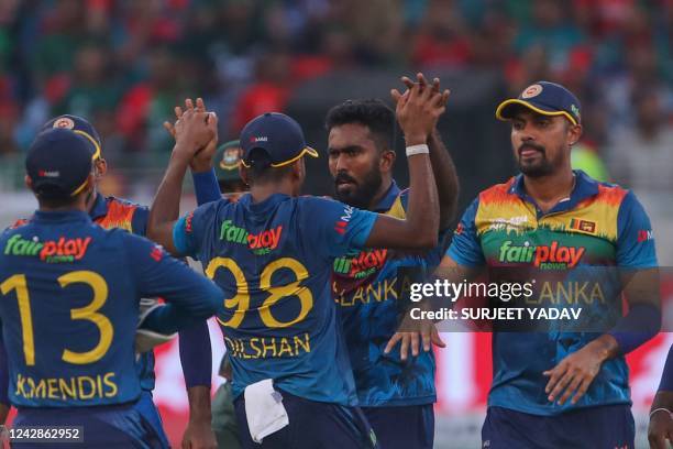 Sri Lanka's Asitha Fernando celebrates with teammates after dismissing Bangladesh's Sabbir Rahman during the Asia Cup Twenty20 international cricket...