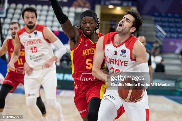 Kendrick Dennard Perry of Montenegro tries to block Furkan Korkmaz of Turkey during the FIBA EuroBasket 2022 group A match between Turkey and...