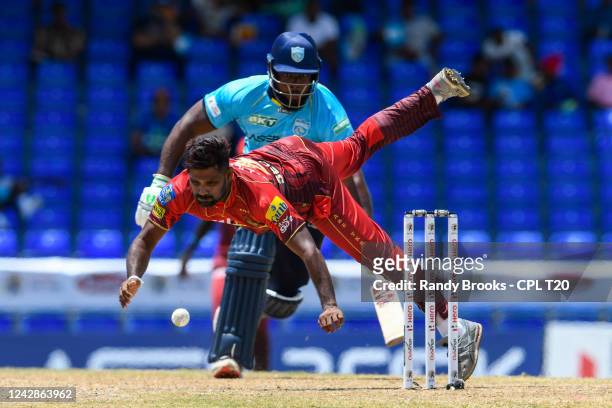 Seekkuge Prasanna of Trinbago Knight Riders attempts to run out Roshon Primus of Saint Lucia Kings during the Men's 2022 Hero Caribbean Premier...