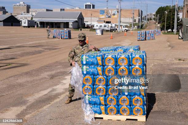 Personnel and equipment from the Mississippi National Guard organize inside of the Mississippi State Fairgrounds in response to the water crisis on...