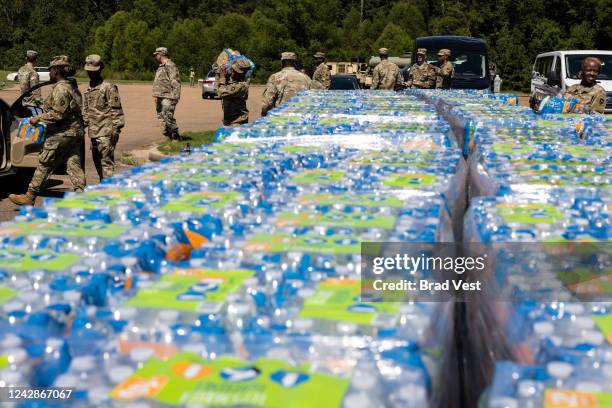 Members of the Mississippi National Guard hand out bottled water at Thomas Cardozo Middle School in response to the water crisis on September 01,...