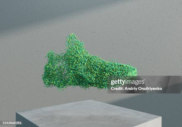 a sport shoe made out of green particles. - groene korte broek stockfoto's en -beelden