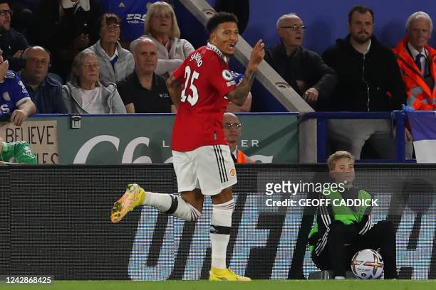 Manchester United's English striker Jadon Sancho celebrates after scoring the opening goal of the English Premier League football match between...