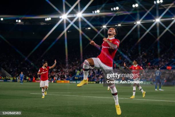 Jadon Sancho of Manchester United celebrates scoring a goal to make the score 0-1 during the Premier League match between Leicester City and...