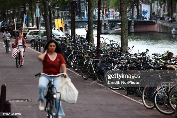View of the bicycle path and bicycle parking in Amsterdam, Netherlands on September 1, 2022.