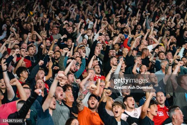 Manchester United fans show their support during the Premier League match between Leicester City and Manchester United at The King Power Stadium on...