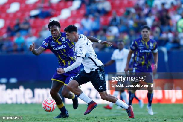 Francisco Contreras of Tijuana competes for the ball with Abel Hernandez of Atletico San Luis during the 12th round match between Atletico San Luis...