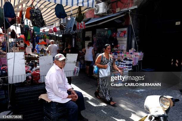 View shows a local market on August 31, 2022 in the "Sanita" district of Naples, Italy. - Like most of southern Italy, Naples -- with its poor public...