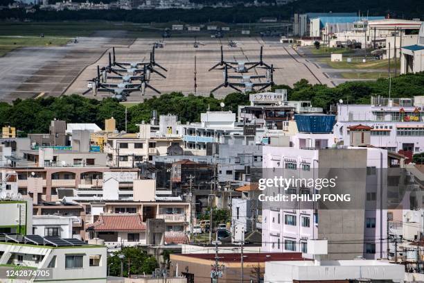 This photo taken on August 23, 2022 shows US military Osprey aircraft at the US Marine Corps Air Station Futenma in the centre of the city of...