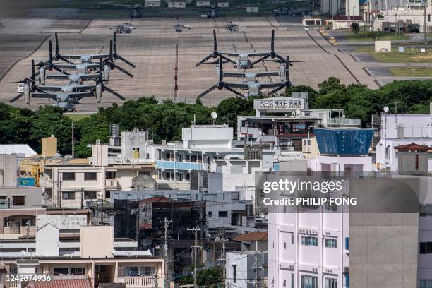 This photo taken on August 23, 2022 shows US military Osprey aircraft at the US Marine Corps Air Station Futenma in the centre of the city of...