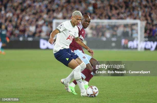 Tottenham Hotspur's Richarlison and West Ham United's Angelo Ogbonna during the Premier League match between West Ham United and Tottenham Hotspur at...