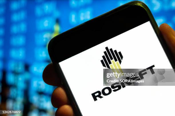 In this photo illustration, the Russian multinational oil and gas company, Rosneft logo is displayed on a smartphone screen.