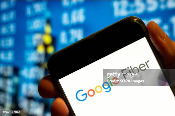 In this photo illustration, the American fast Internet service provider by Google, Google Fiber, logo is displayed on a smartphone screen.