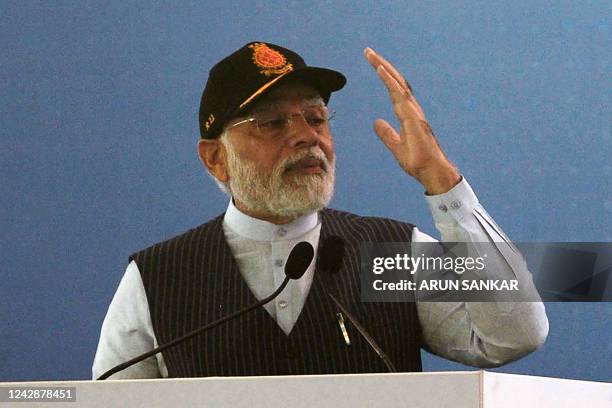 Indian Prime Minister Narendra Modi gestures as he speaks during the commissioning of the Indian indigenous aircraft carrier INS Vikrant at Cochin...