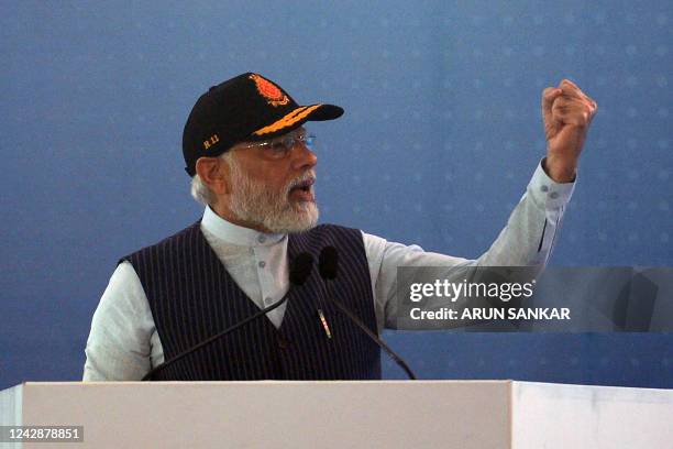 Indian Prime Minister Narendra Modi gestures as he speaks during the commissioning of the Indian indigenous aircraft carrier INS Vikrant at Cochin...